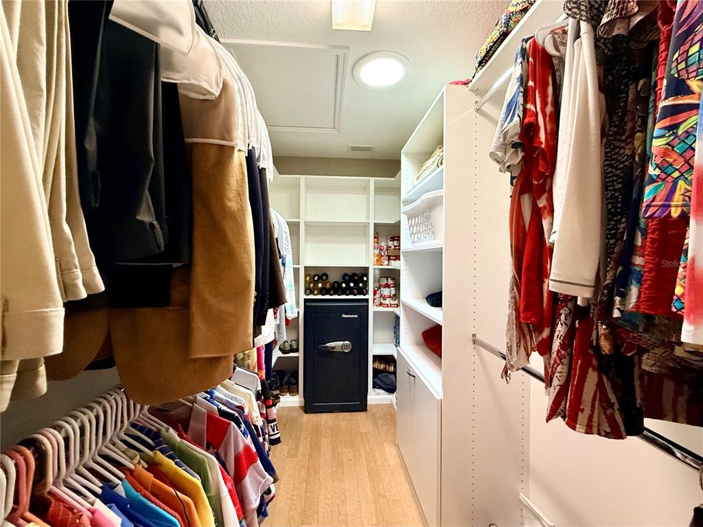 16296 Southwest 15th Court Ocala, FL 34473 - Photo 47 of 70 a view of walk in closet with clothes and shoes