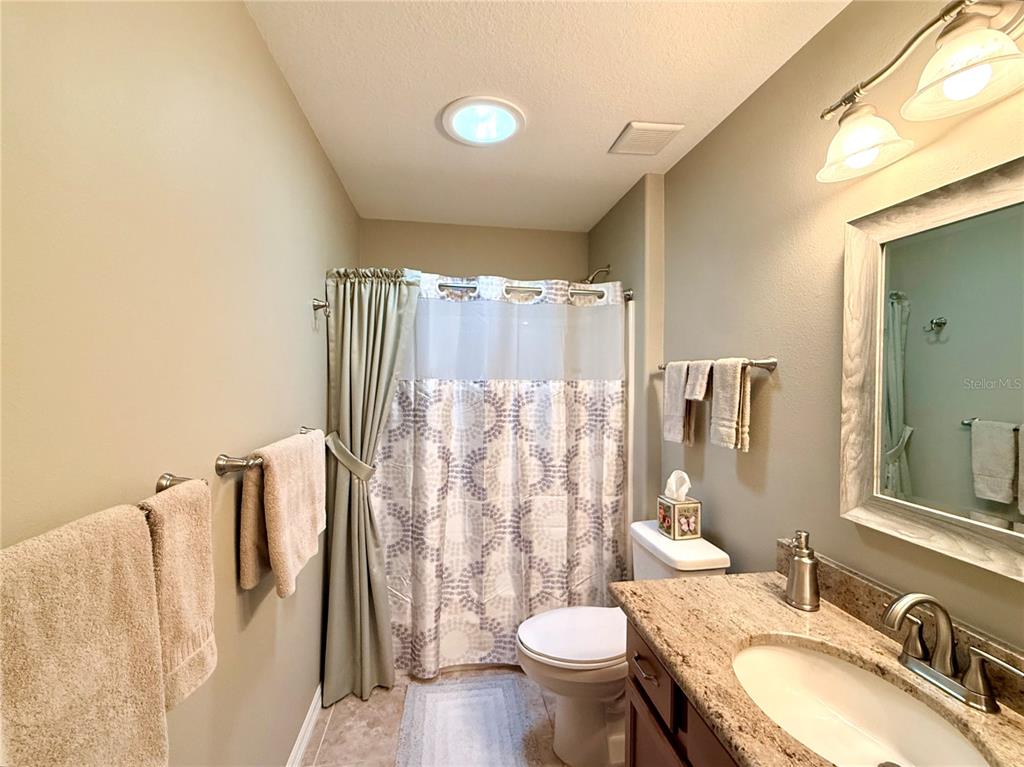 16296 Southwest 15th Court Ocala, FL 34473 - Photo 53 of 70 a bathroom with a granite countertop sink toilet and shower