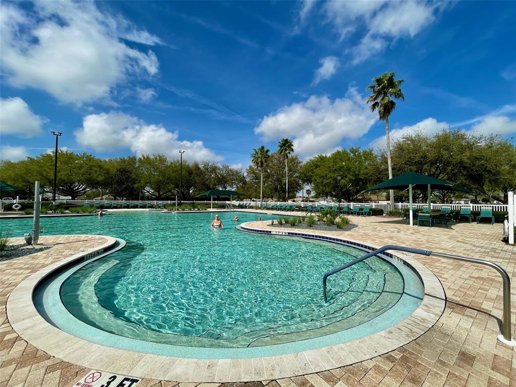16296 Southwest 15th Court Ocala, FL 34473 - Photo 62 of 70 a view of a swimming pool with a yard