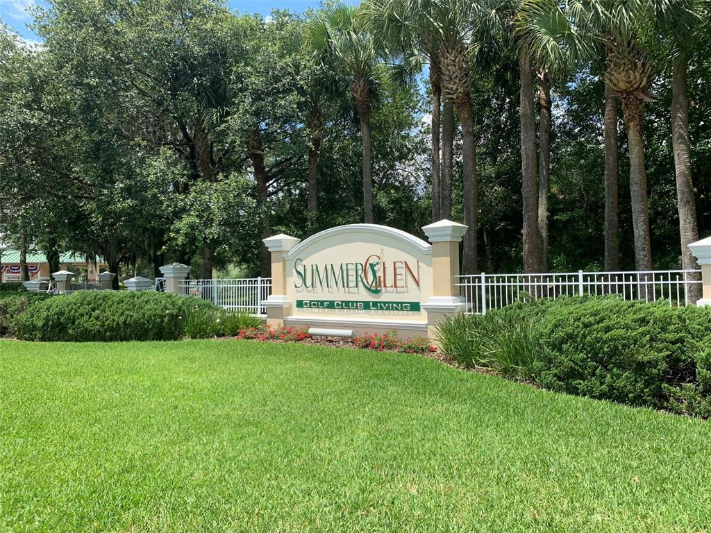 16296 Southwest 15th Court Ocala, FL 34473 - Photo 70 of 70 a sign that is sitting in the grass near a tree