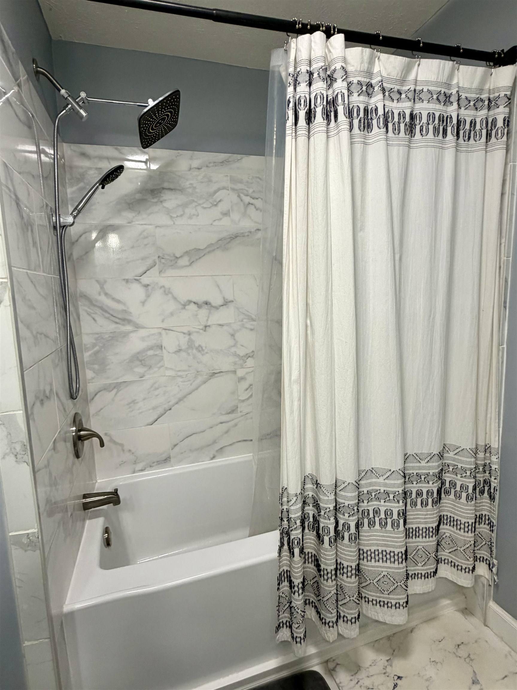 8022 45th Highway Ramer, TN 38367 - Photo 12 of 20 a bathroom with a bathtub and shower