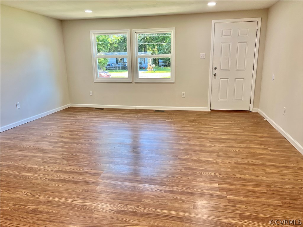 3440 The Loop Road Richmond, VA 23231 - Photo 13 of 22 a view of an empty room with wooden floor and a window