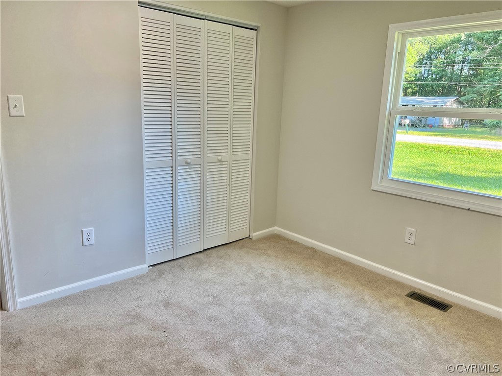 3440 The Loop Road Richmond, VA 23231 - Photo 17 of 22 a view of an empty room with a window