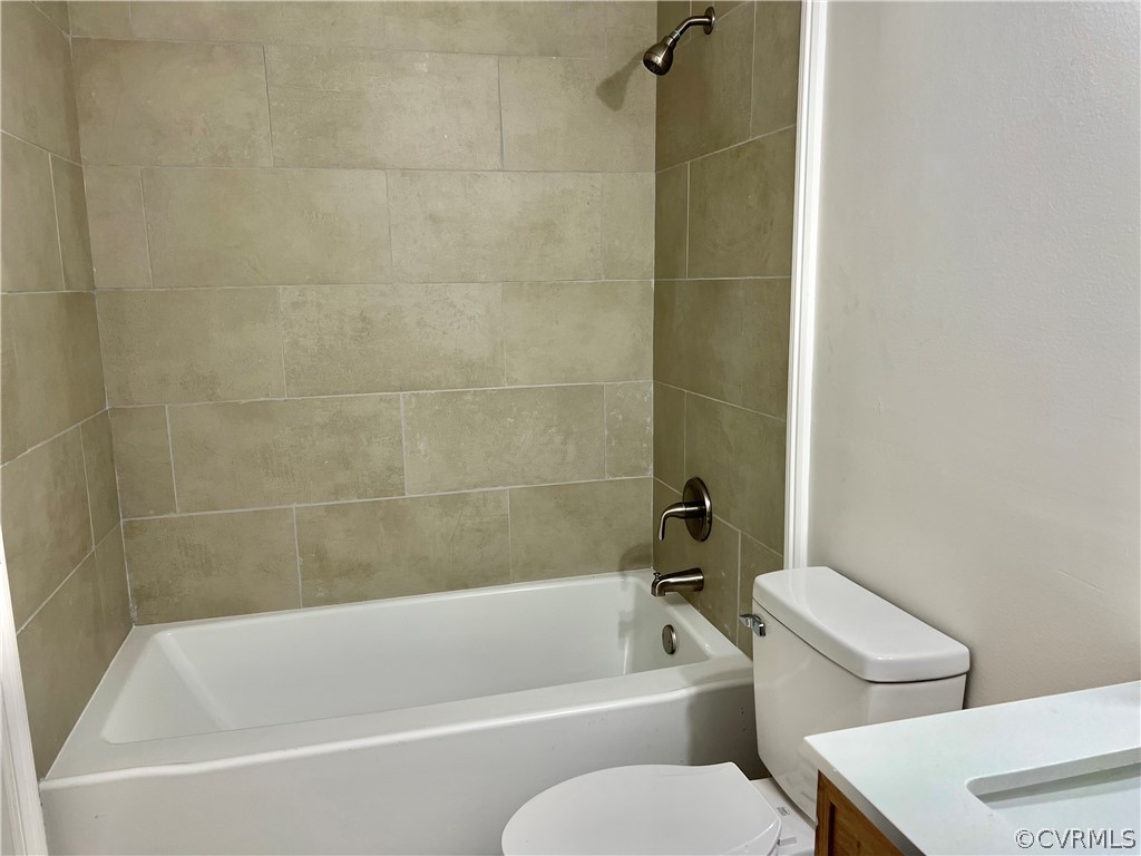 3440 The Loop Road Richmond, VA 23231 - Photo 18 of 22 a white bath tub sitting next to a white toilet and sink