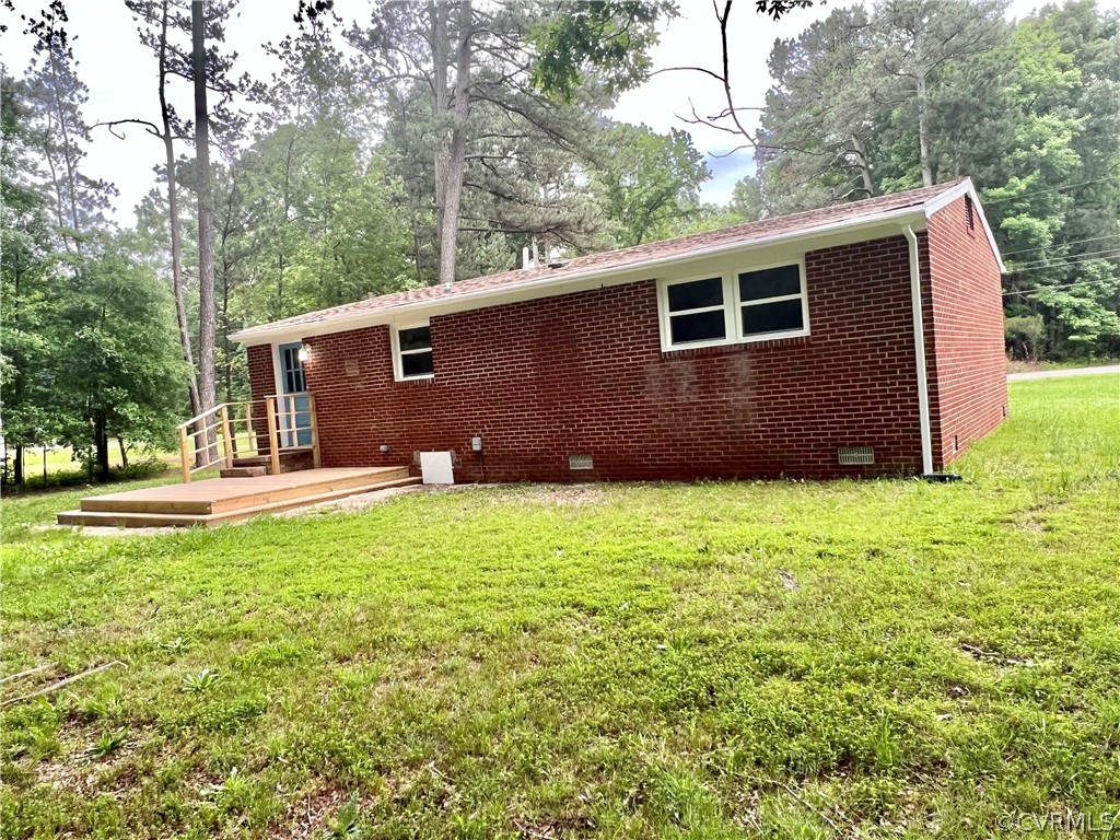 3440 The Loop Road Richmond, VA 23231 - Photo 21 of 22 a backyard of a house with lots of green space