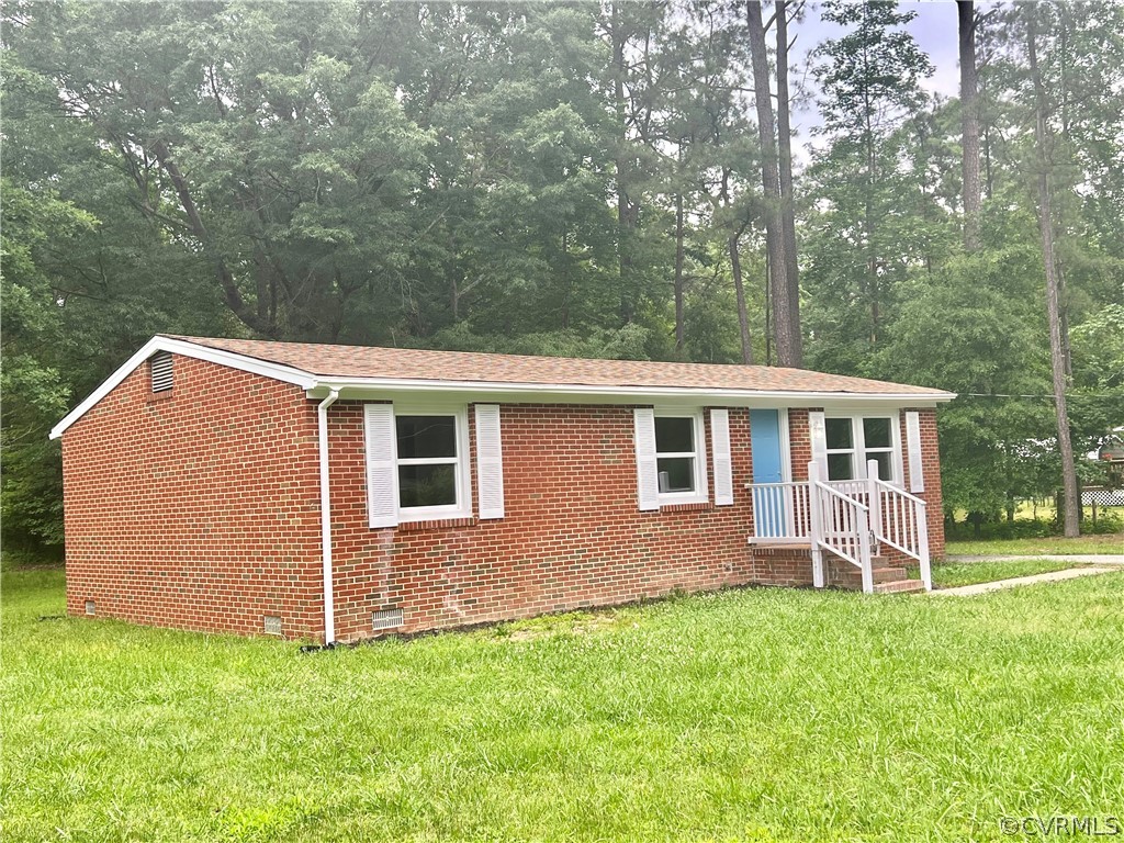 3440 The Loop Road Richmond, VA 23231 - Photo 3 of 22 a front view of a house with a yard