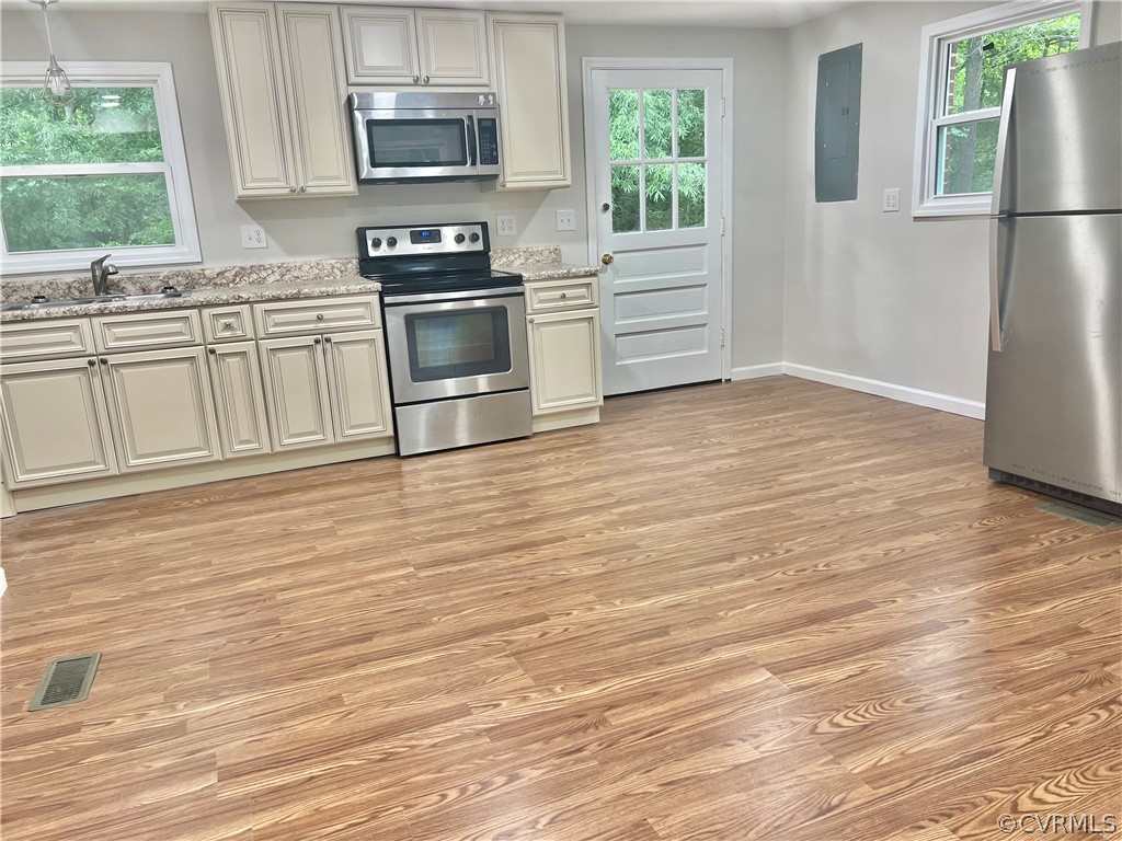3440 The Loop Road Richmond, VA 23231 - Photo 8 of 22 a kitchen with granite countertop a refrigerator stove and sink