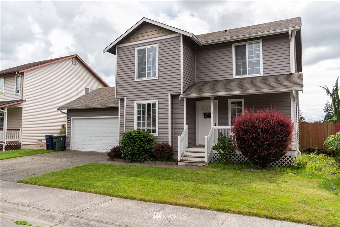 408 Rohrer Loop Sedro-Woolley, WA 98284 - Photo 1 of 20 a view of a house with a yard and plants