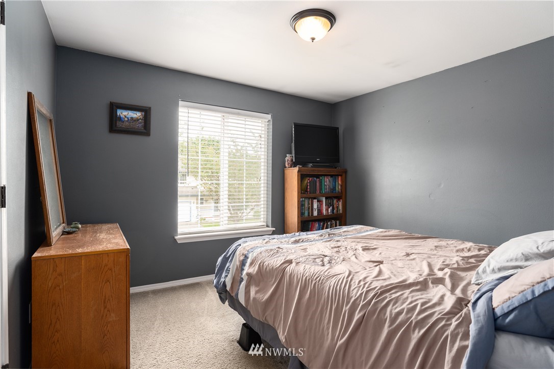 408 Rohrer Loop Sedro-Woolley, WA 98284 - Photo 12 of 20 a bedroom with a bed and a flat screen tv