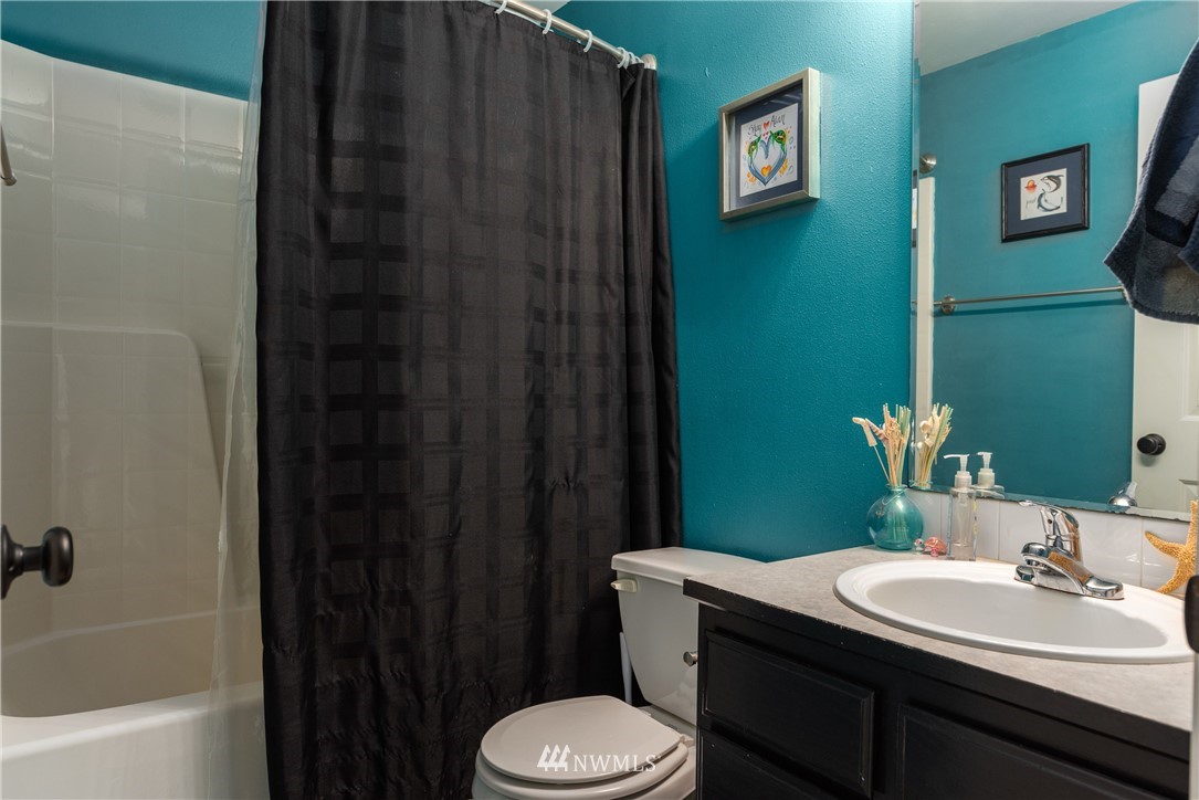 408 Rohrer Loop Sedro-Woolley, WA 98284 - Photo 13 of 20 a bathroom with a sink a toilet and shower