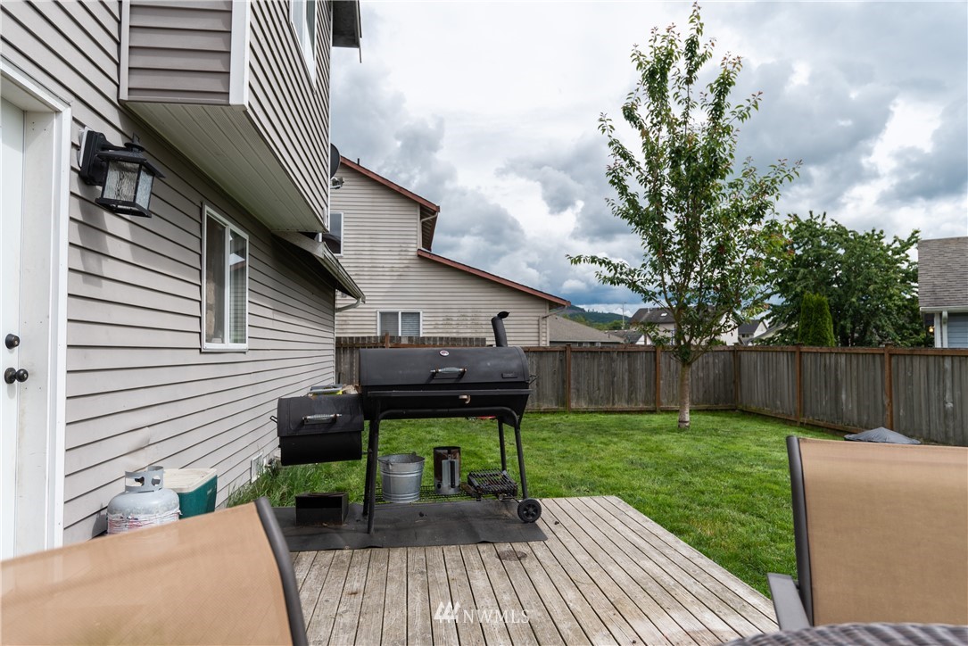 408 Rohrer Loop Sedro-Woolley, WA 98284 - Photo 19 of 20 a view of house with backyard and furniture