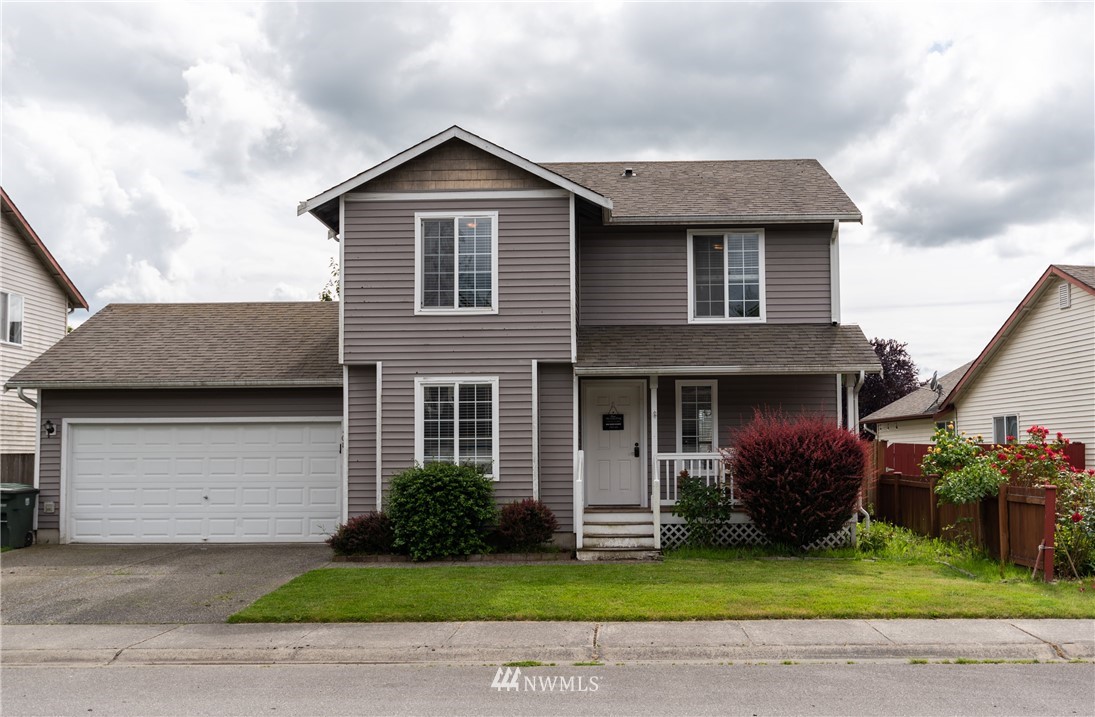 408 Rohrer Loop Sedro-Woolley, WA 98284 - Photo 20 of 20 a front view of a house with a garden and plants
