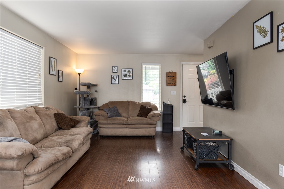 408 Rohrer Loop Sedro-Woolley, WA 98284 - Photo 5 of 20 a living room with furniture a flat screen tv and a window
