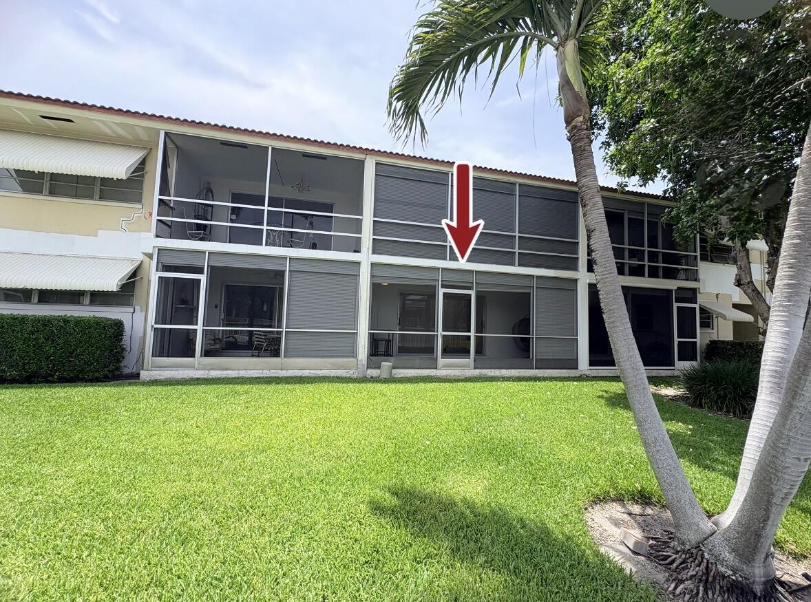 2202 Northeast 36th Street, Unit 17 Lighthouse Point, FL 33064 - Photo 2 of 28 Backyard view of Condo with Arrow