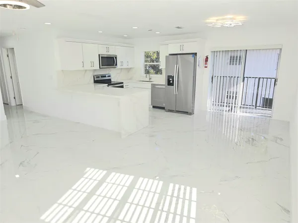 a view of a kitchen with a sink