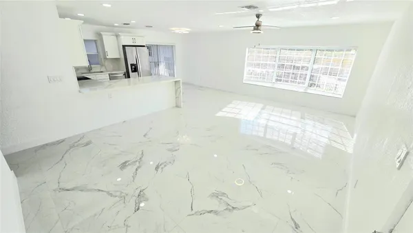 a view of kitchen with wooden floor