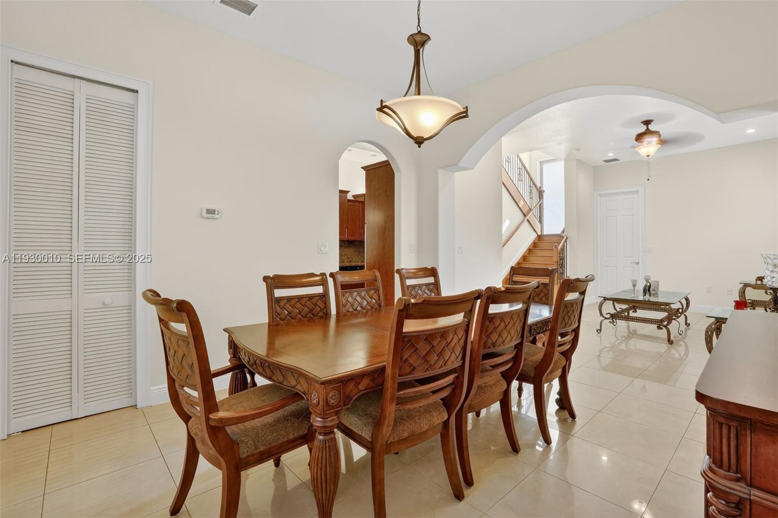2913 Southwest 13th Street Miami, FL 33145 - Photo 11 of 55 a view of a dining room with furniture and a chandelier