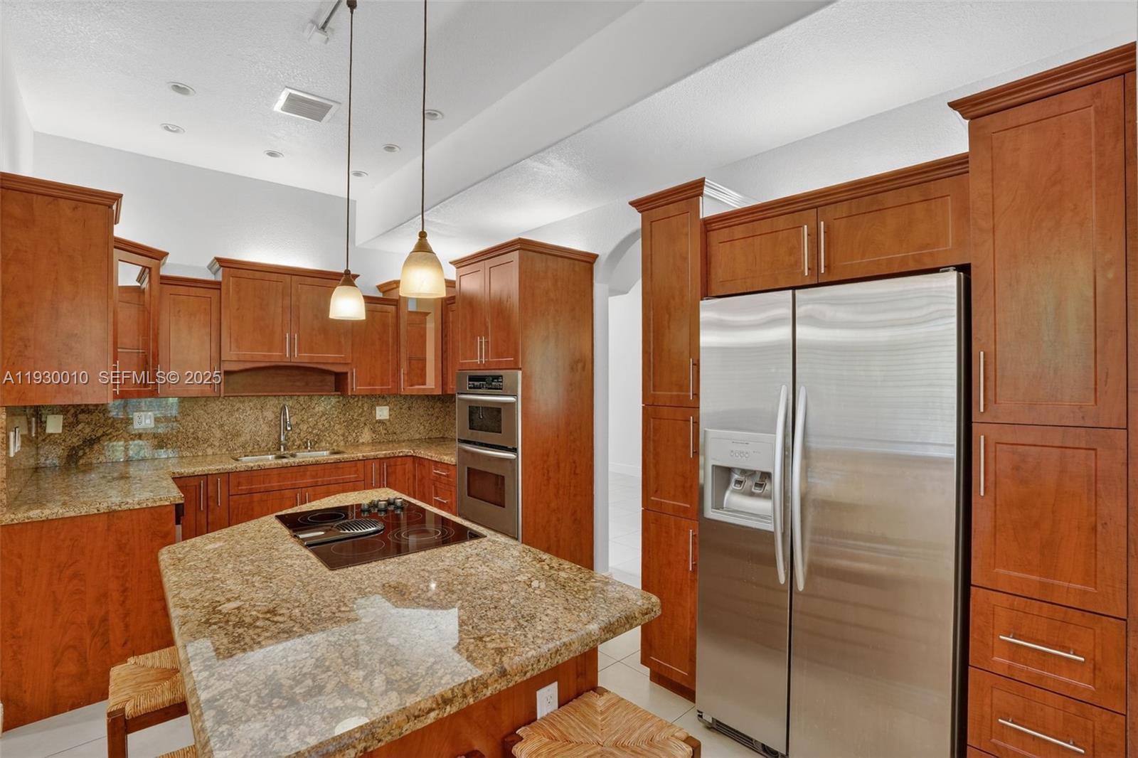 2913 Southwest 13th Street Miami, FL 33145 - Photo 12 of 55 a kitchen with stainless steel appliances granite countertop a refrigerator a oven and a sink