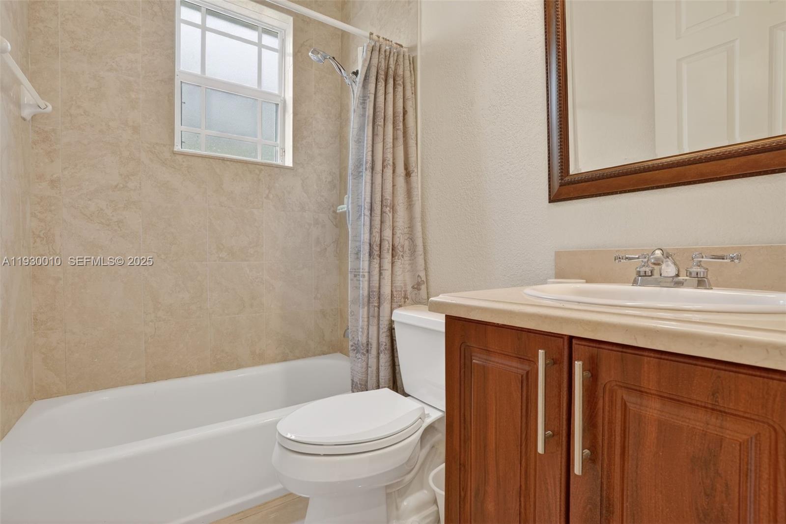 2913 Southwest 13th Street Miami, FL 33145 - Photo 21 of 55 a bathroom with a sink a toilet and shower