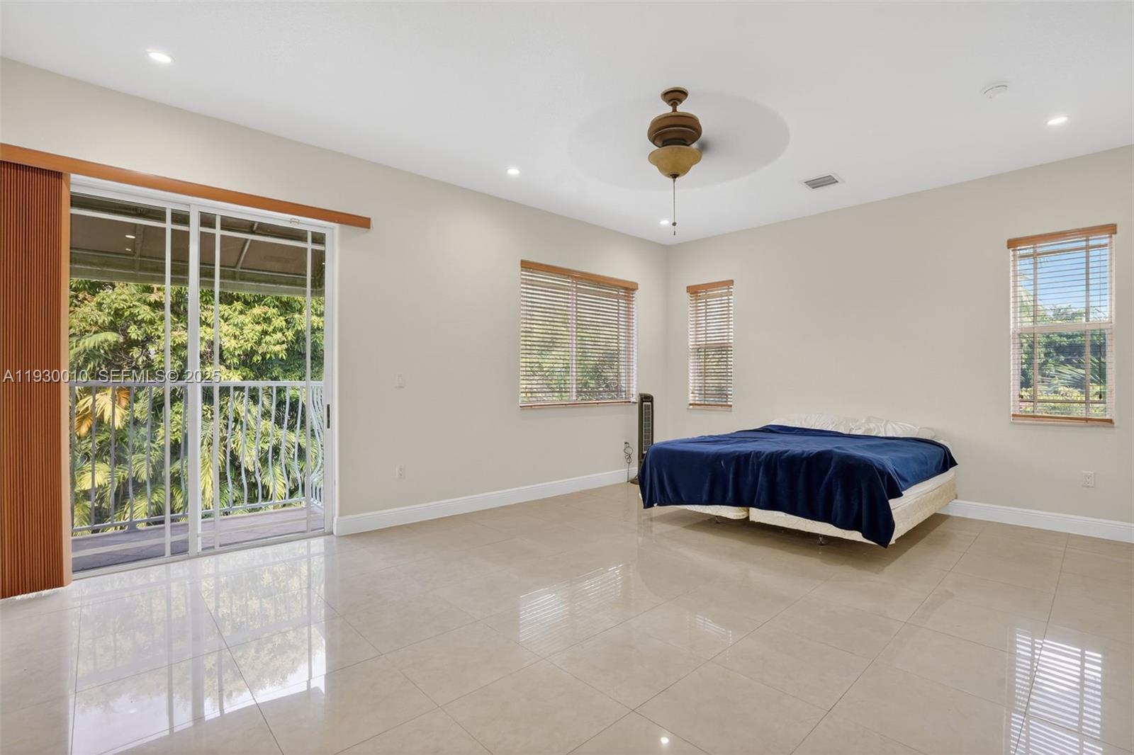 2913 Southwest 13th Street Miami, FL 33145 - Photo 26 of 55 a spacious bedroom with a large bed and a large window