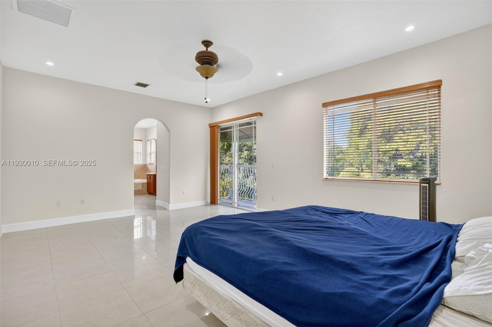 2913 Southwest 13th Street Miami, FL 33145 - Photo 27 of 55 a spacious bedroom with a large bed and a large window