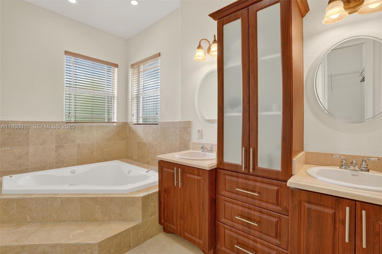 2913 Southwest 13th Street Miami, FL 33145 - Photo 30 of 55 a bathroom with a granite countertop sink and a bathtub