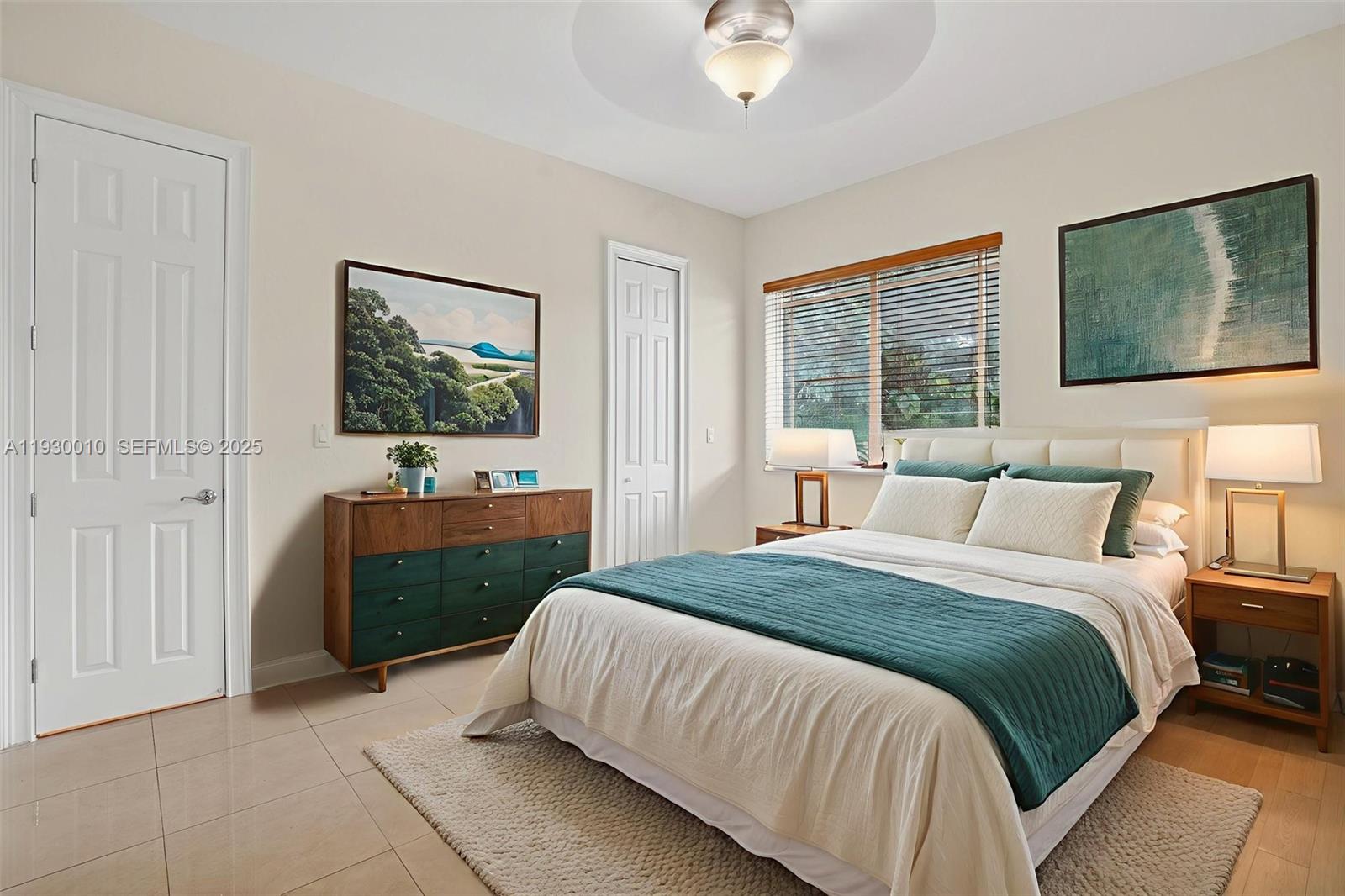 2913 Southwest 13th Street Miami, FL 33145 - Photo 40 of 55 a spacious bedroom with a bed and a flat screen tv