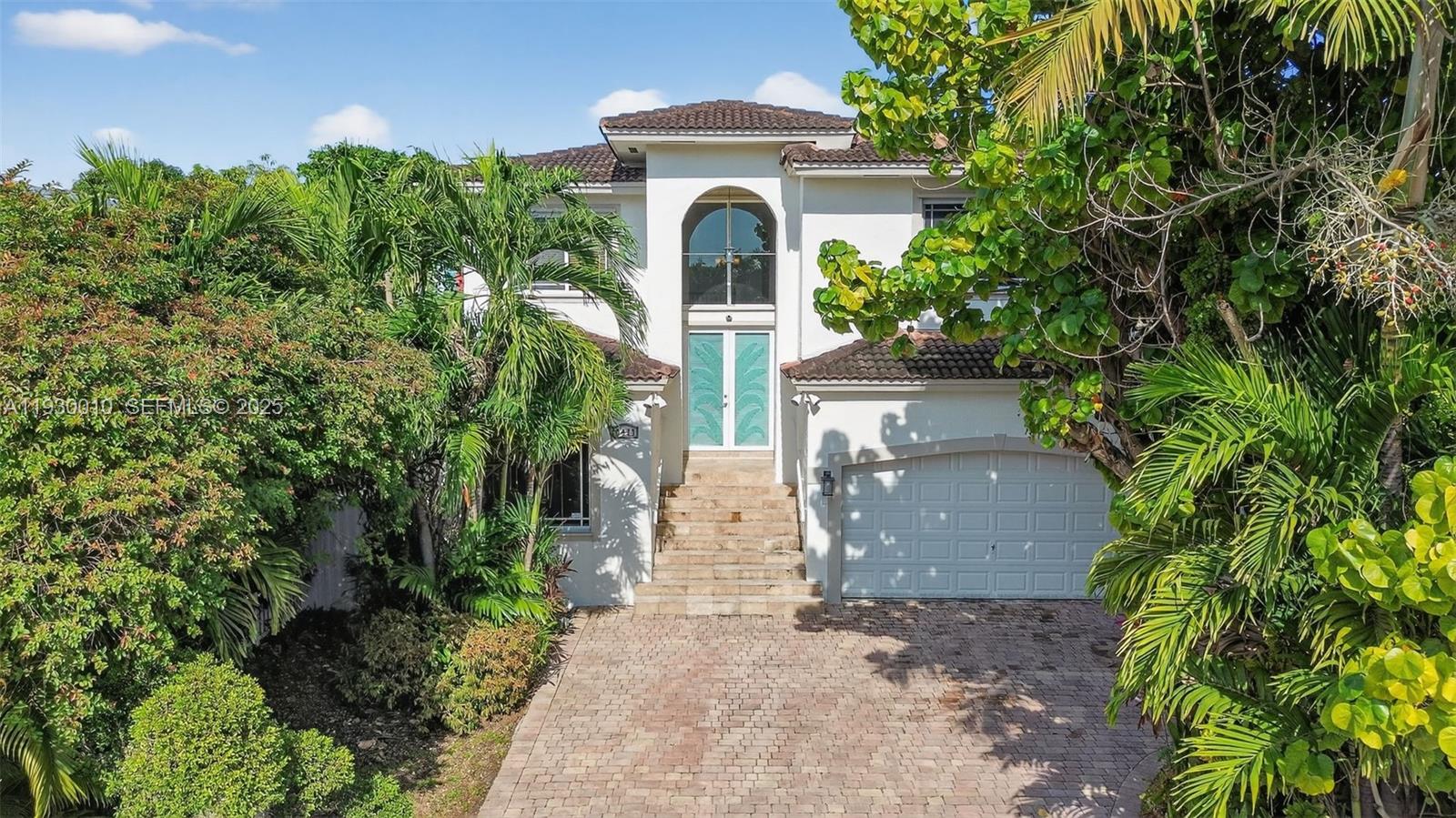 2913 Southwest 13th Street Miami, FL 33145 - Photo 4 of 55 a front view of a house with a yard