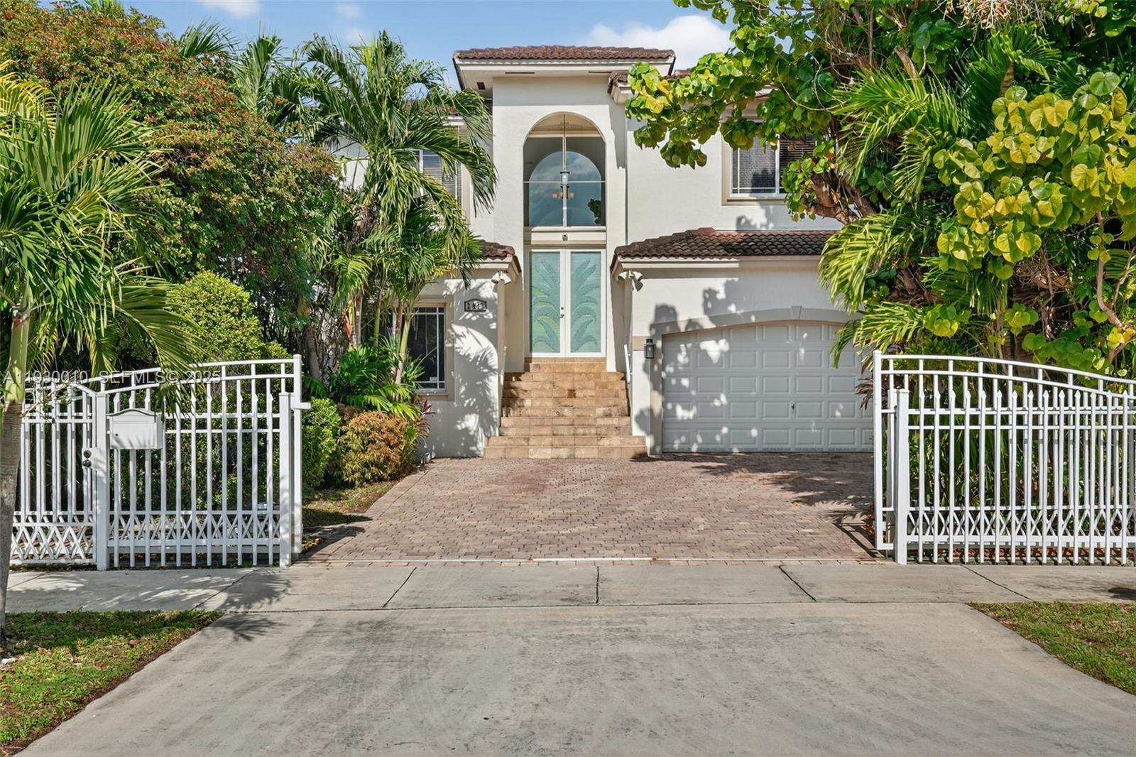 2913 Southwest 13th Street Miami, FL 33145 - Photo 55 of 55 a front view of a house with a garden
