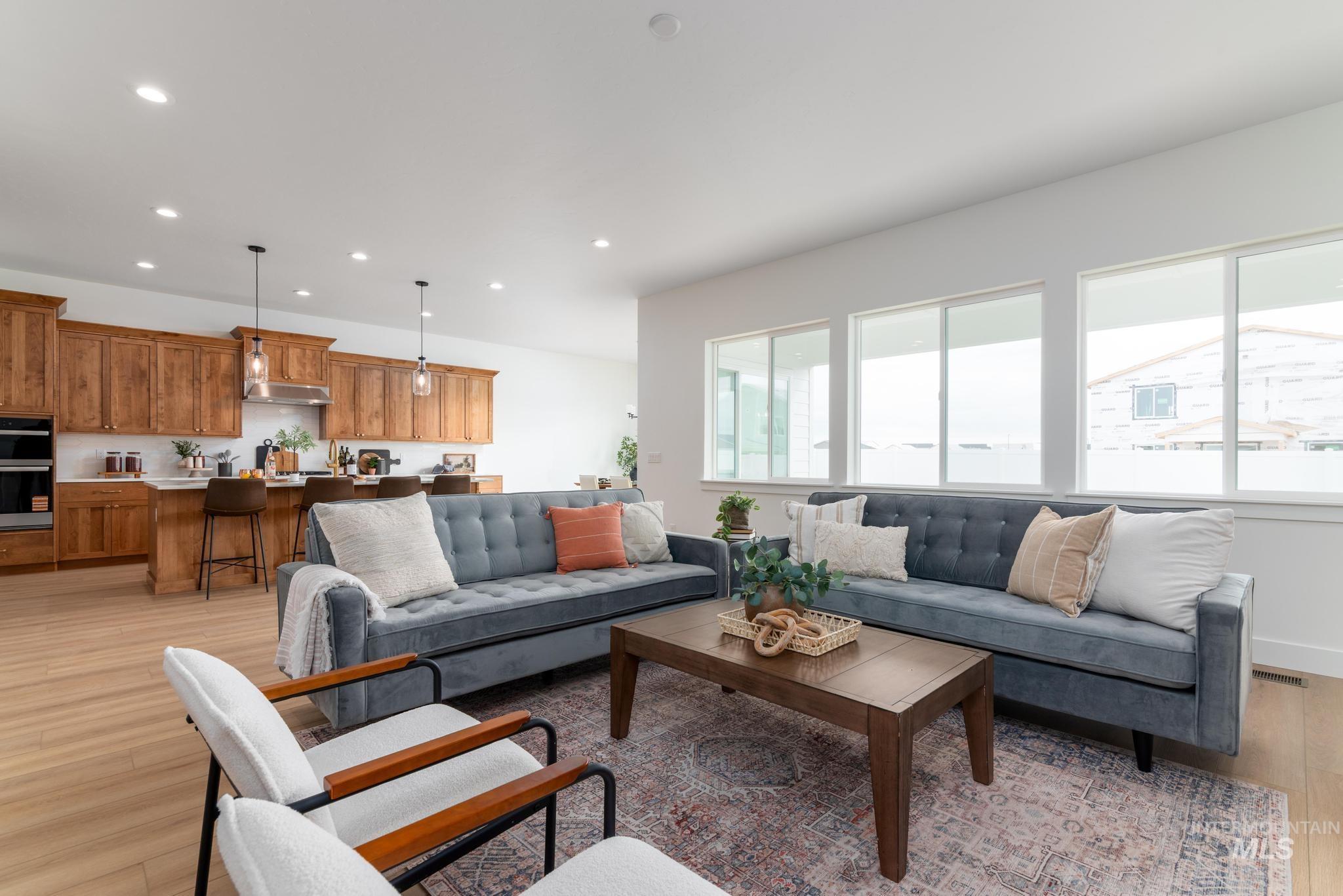 8569 South Silver Smog Way Meridian, ID 83642 - Photo 4 of 14 Living room featuring light wood finished floors and recessed lighting