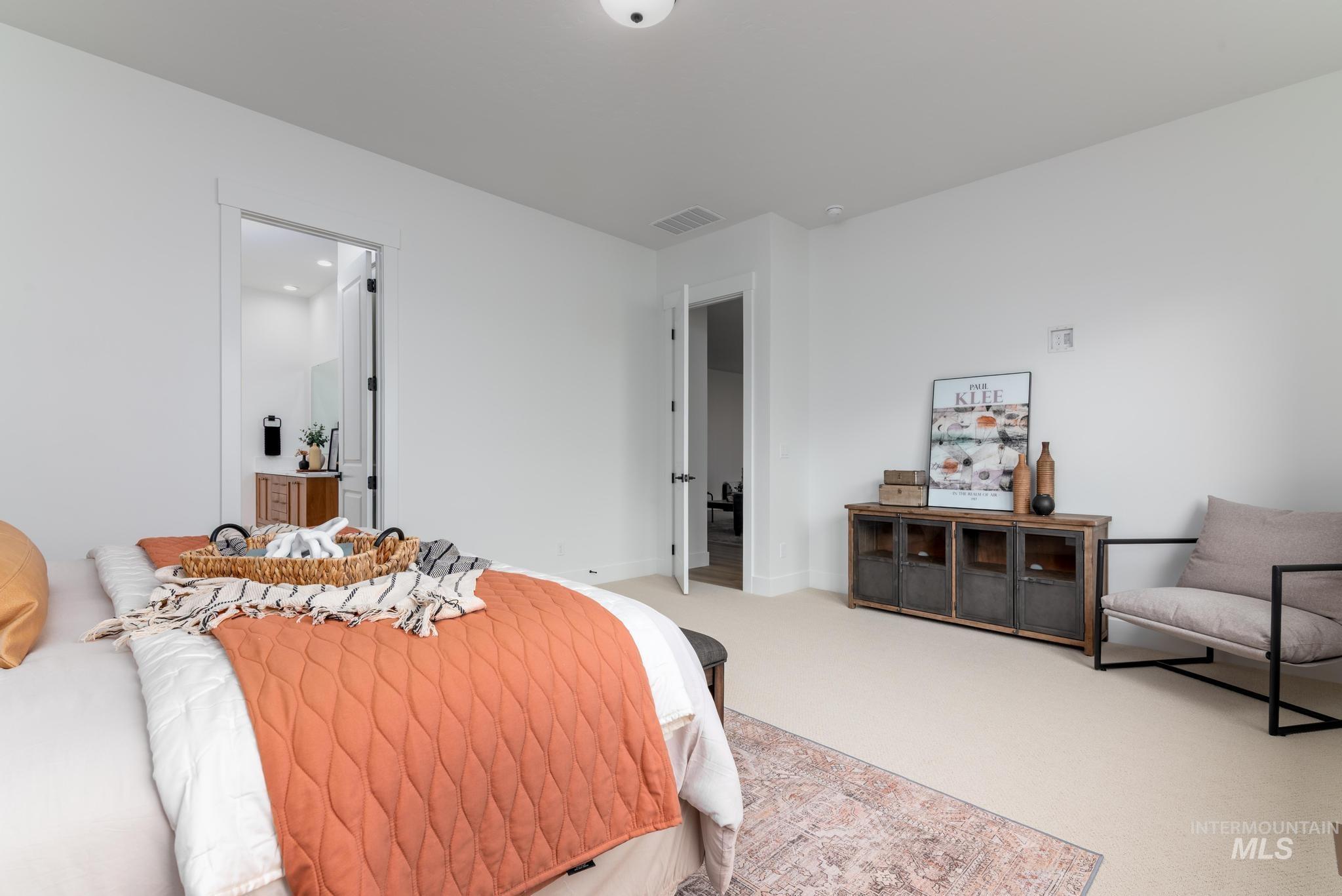 8569 South Silver Smog Way Meridian, ID 83642 - Photo 10 of 14 Bedroom featuring carpet and baseboards