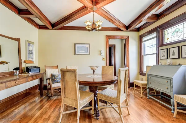 a dining room with furniture and window