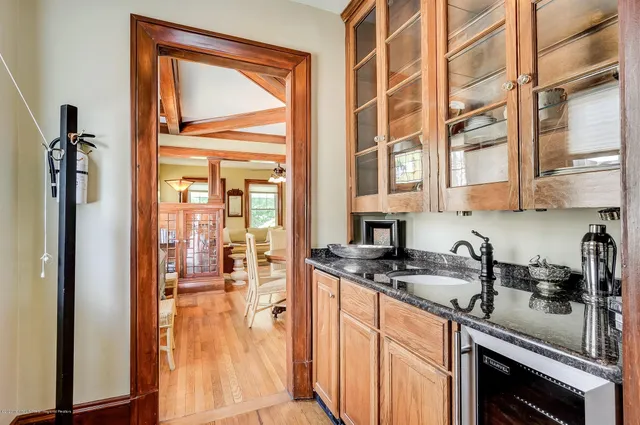 a kitchen with stainless steel appliances granite countertop a sink and a refrigerator