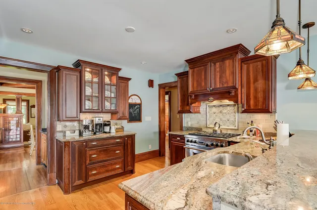 a kitchen with a sink stove and cabinets