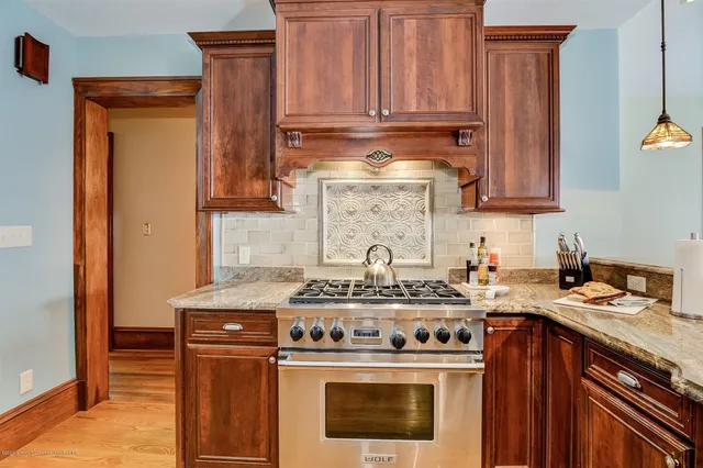 a kitchen with a stove and a sink
