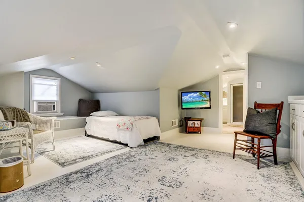 a bedroom with a bed and furniture