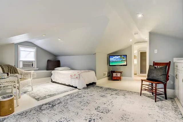 a bedroom with a bed and furniture