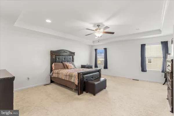 a bedroom with a bed and a television
