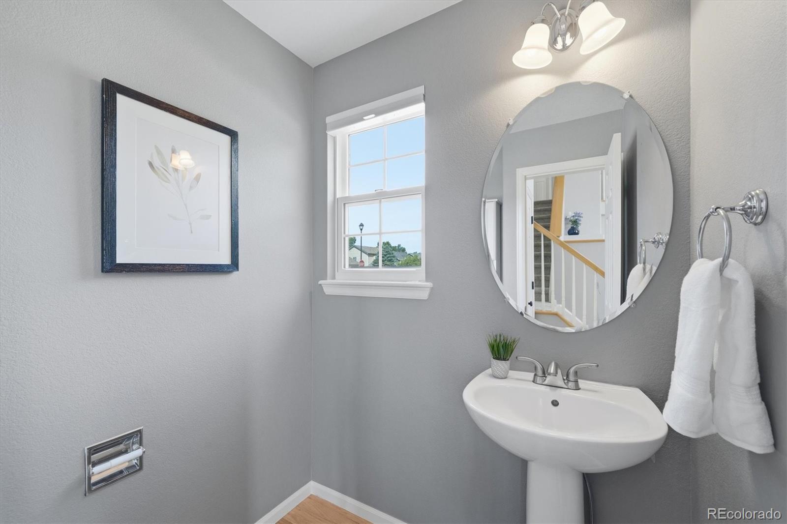 9629 Burberry Way Highlands Ranch, CO 80129 - Photo 20 of 50 a bathroom with a sink and a mirror