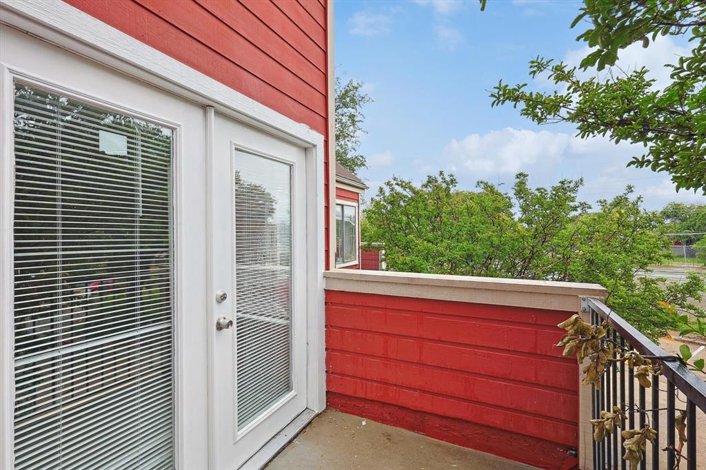 9805 Walnut Street, Unit 201 Dallas, TX 75243 - Photo 25 of 26 a view of a balcony with a couple of flower plants