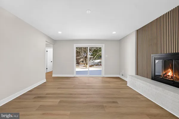 a view of room with window and ceiling fan
