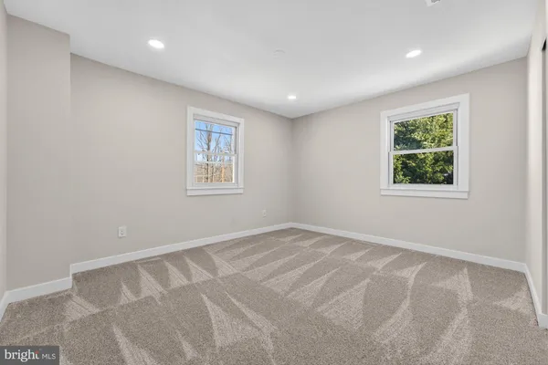 a view of an empty room with stairs