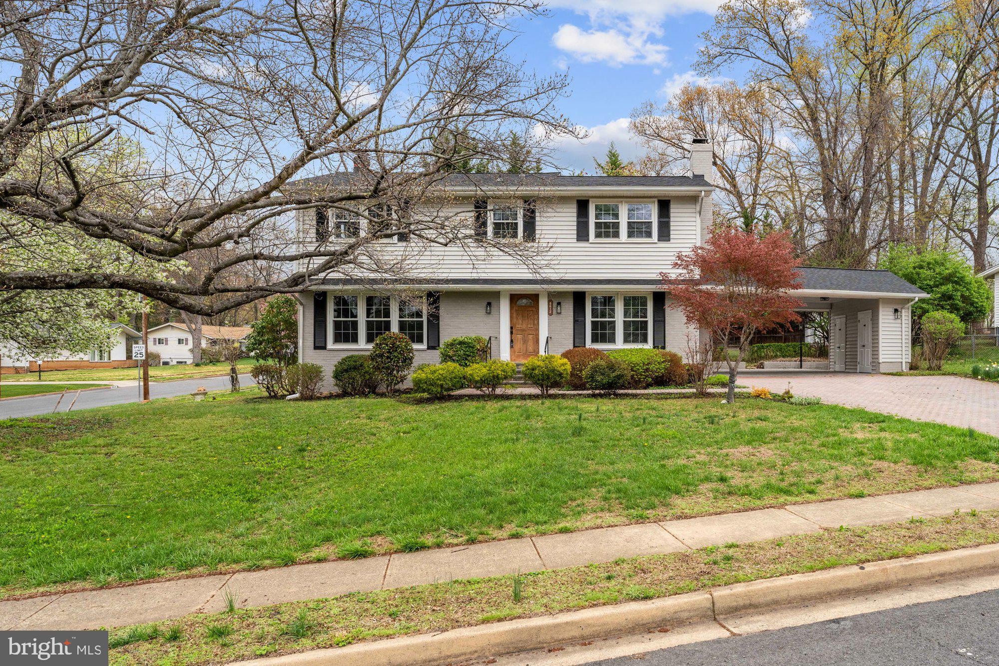 8612 Cottage Street Vienna, VA 22180 - Photo 52 of 65 a front view of a house with a yard