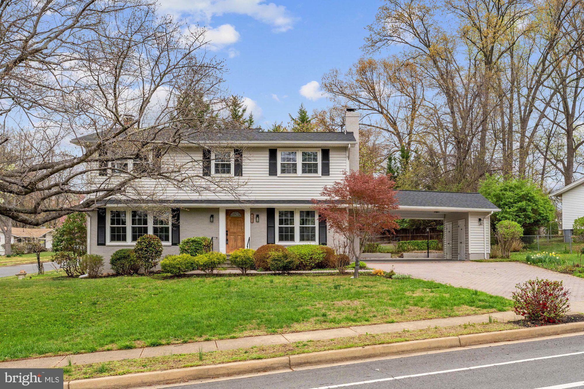 8612 Cottage Street Vienna, VA 22180 - Photo 54 of 65 a front view of a house with a garden