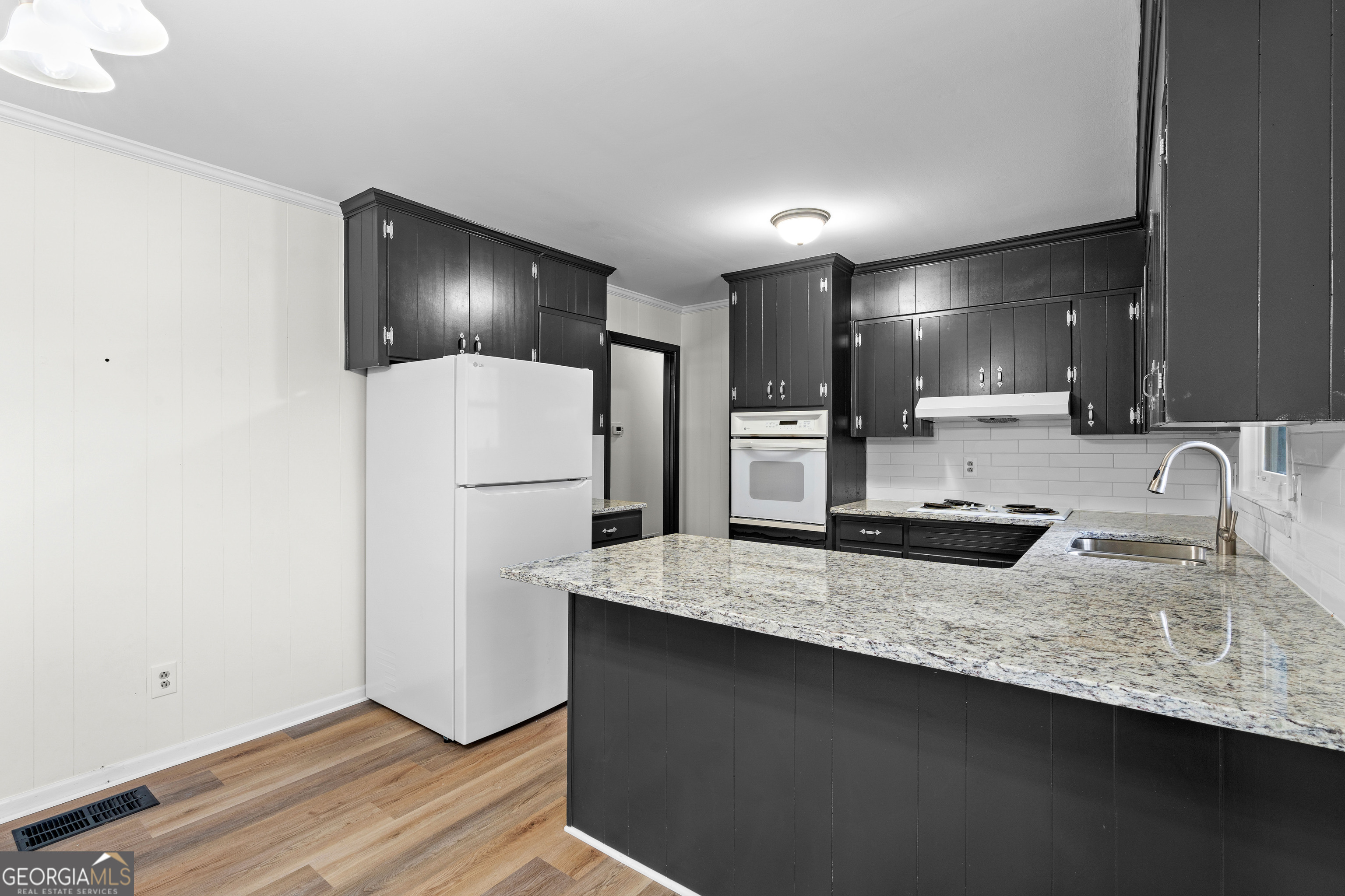 3548 Meadowview Court Rex, GA 30273 - Photo 13 of 41 a kitchen with a refrigerator and a sink