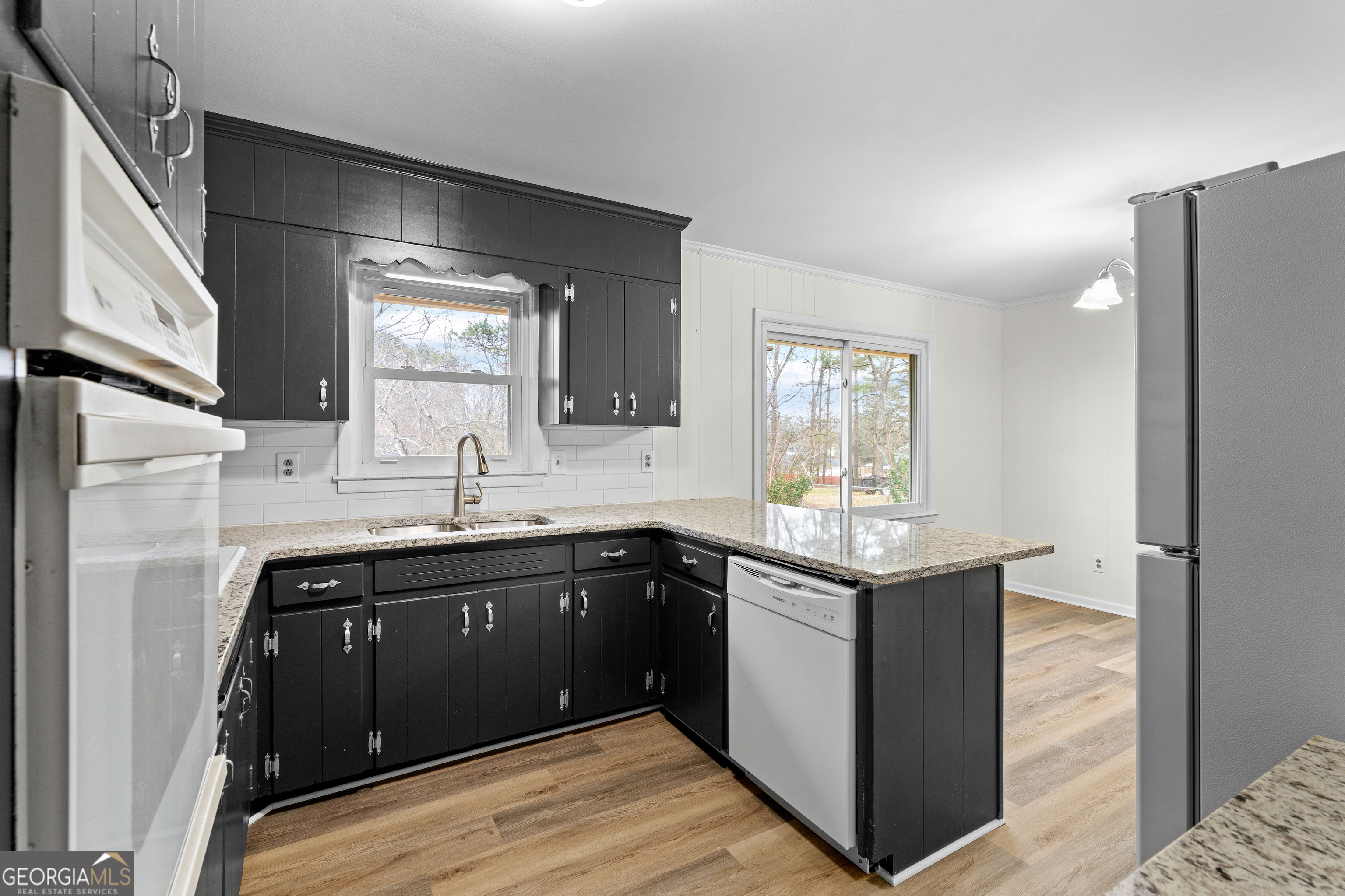 3548 Meadowview Court Rex, GA 30273 - Photo 17 of 41 a kitchen with stainless steel appliances granite countertop a sink stove and refrigerator
