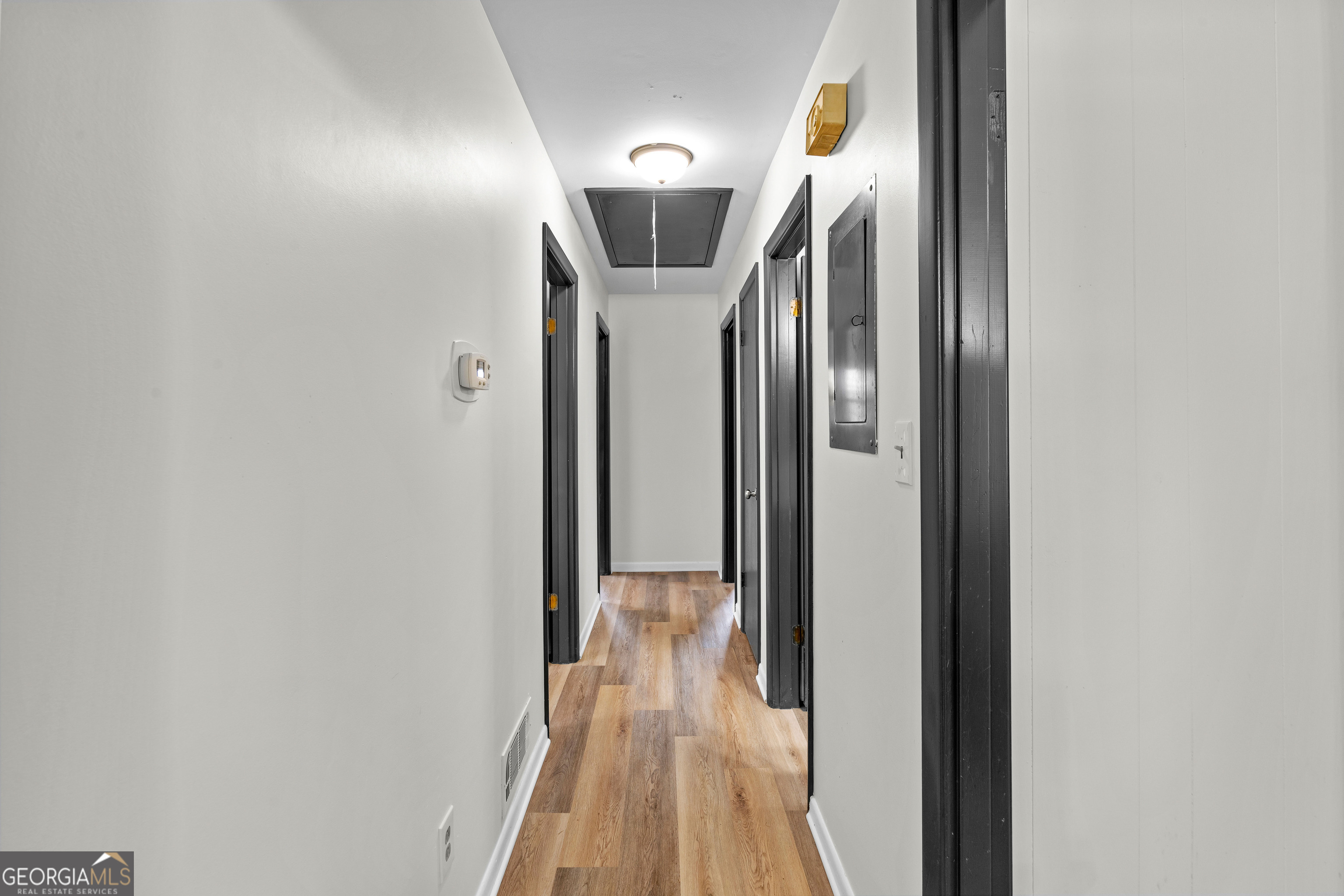 3548 Meadowview Court Rex, GA 30273 - Photo 18 of 41 a view of a hallway with wooden floor and entryway