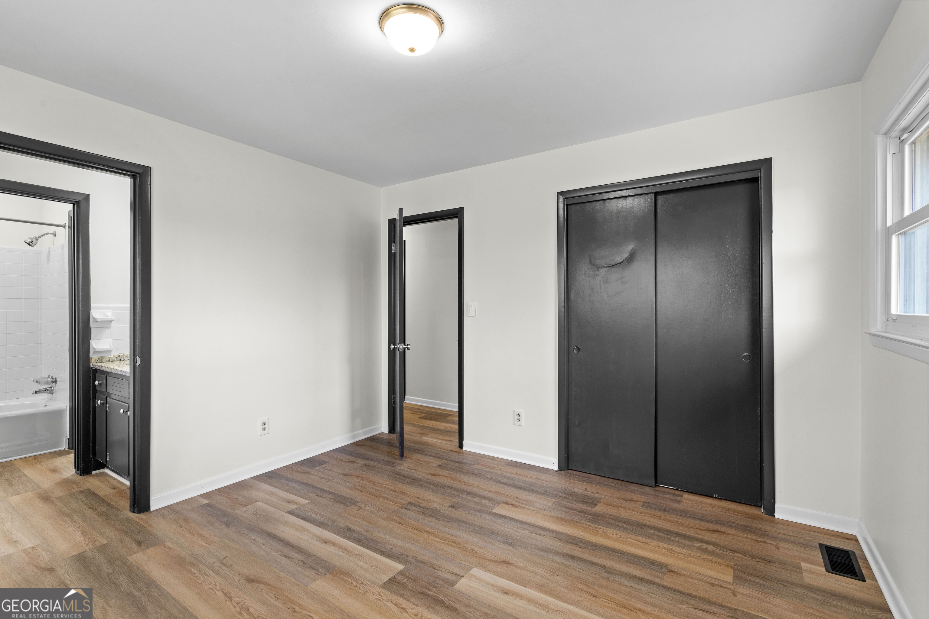 3548 Meadowview Court Rex, GA 30273 - Photo 22 of 41 an empty room with closet and mirror