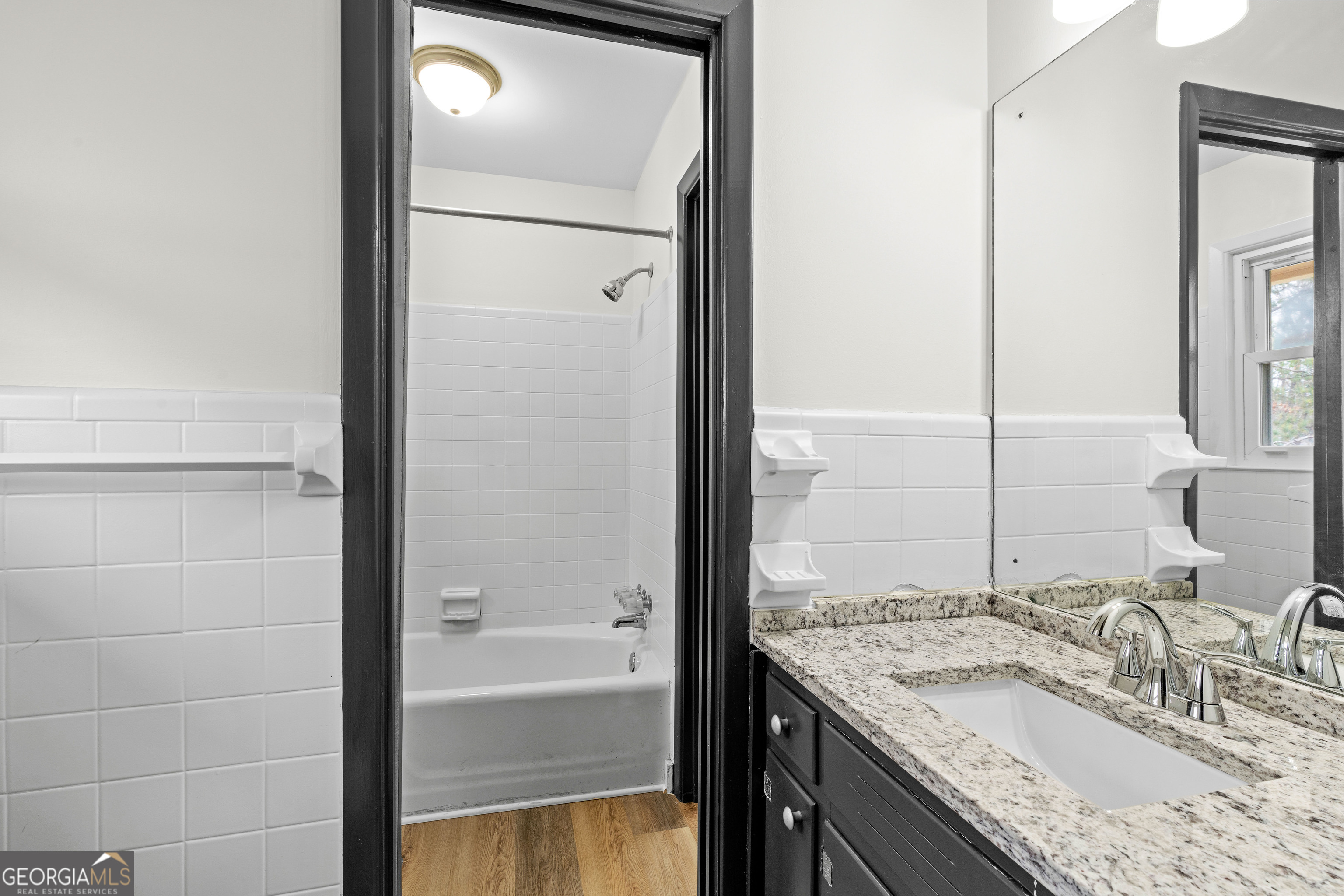 3548 Meadowview Court Rex, GA 30273 - Photo 24 of 41 a bathroom with a granite countertop sink and a mirror
