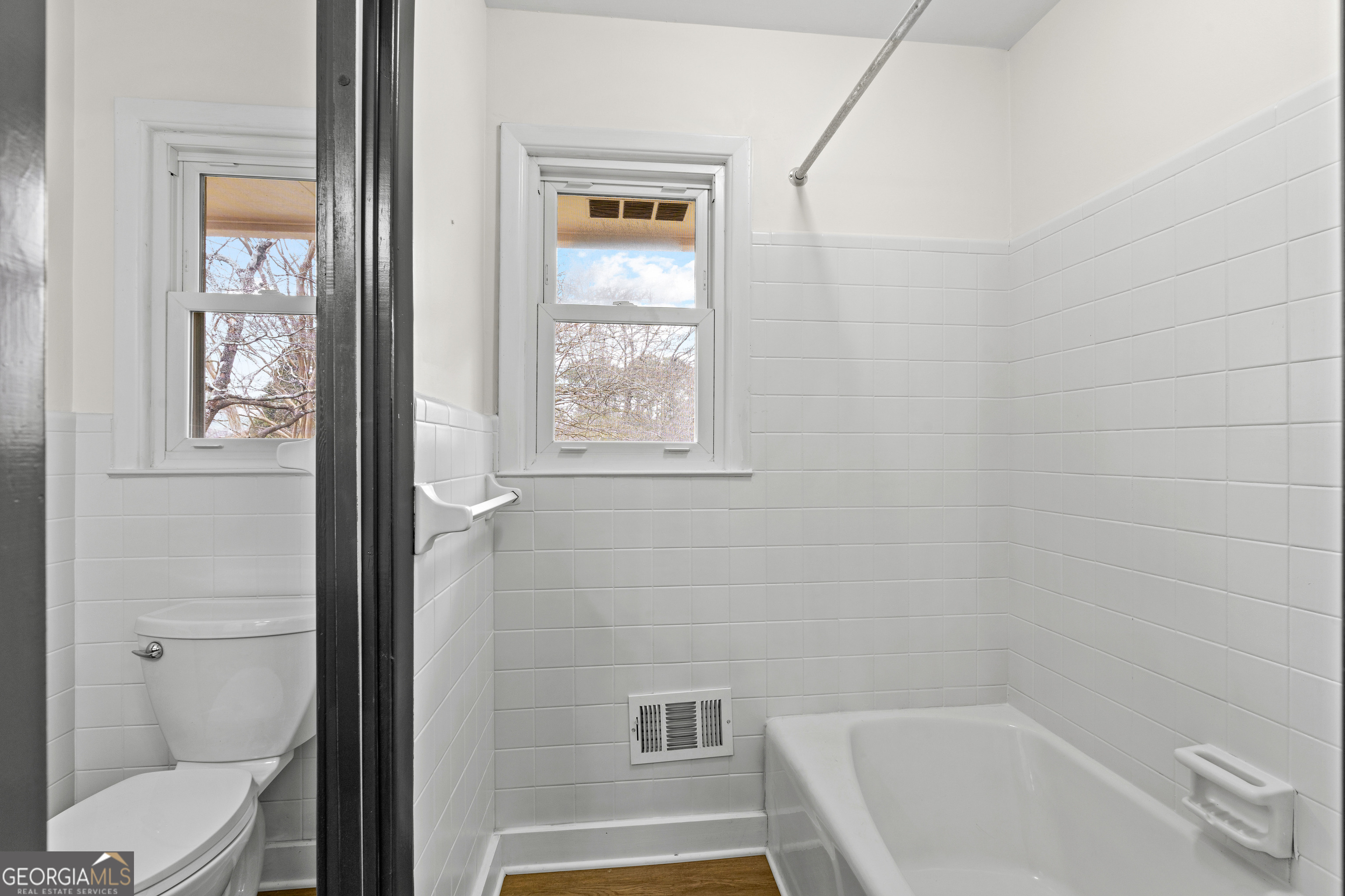 3548 Meadowview Court Rex, GA 30273 - Photo 25 of 41 a bathroom with a tub a toilet and a shower